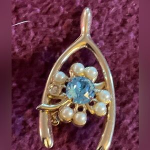 Vintage gold tone wish bone brooch